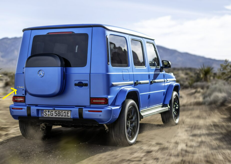 2025 Mercedes-Benz G-Class EV electric luxury SUV driving through rugged terrain, showcasing its off-road capabilities and iconic design.