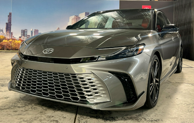2025 Toyota Camry parked on a scenic highway
